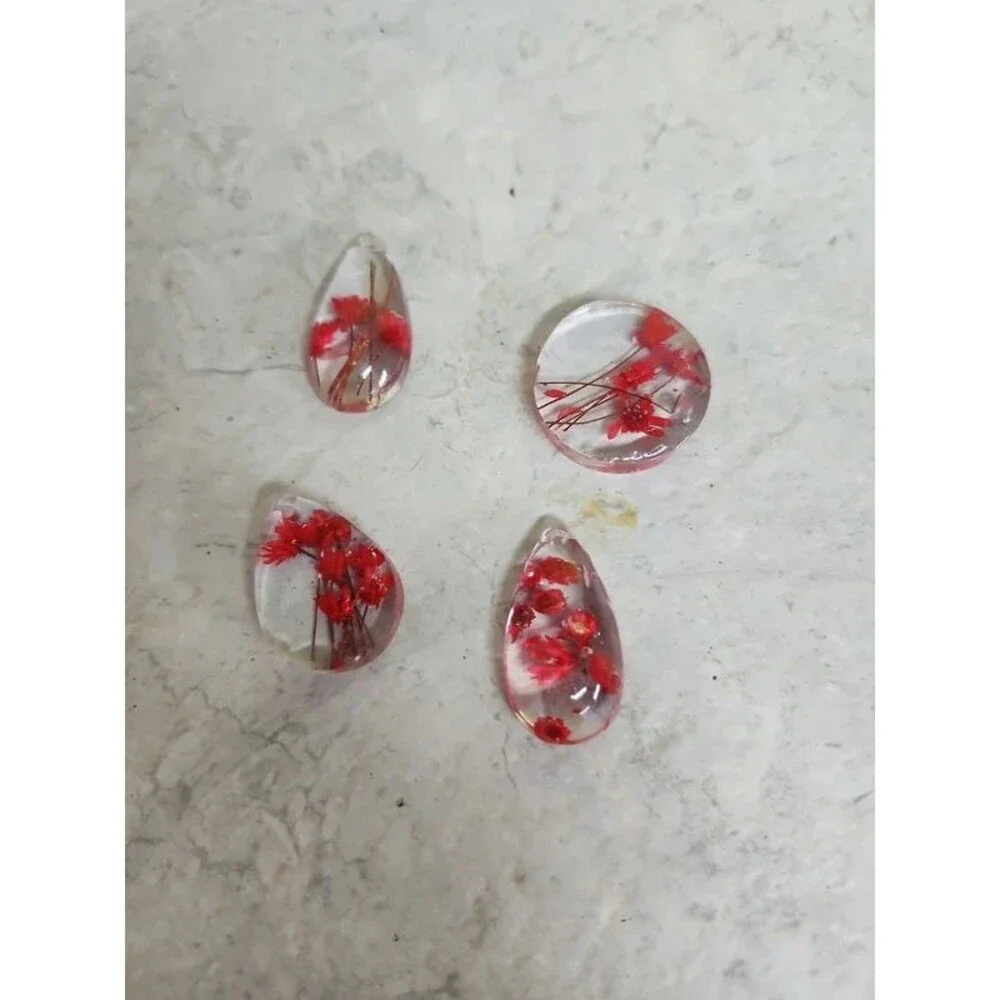 Hand crafted resin and dried flower beads, charms